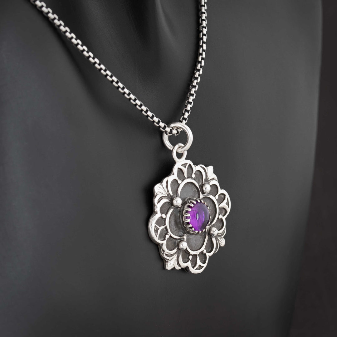 Gothic quatrefoil silver pendant featuring 7mm amethyst cabochon and ornate detailing