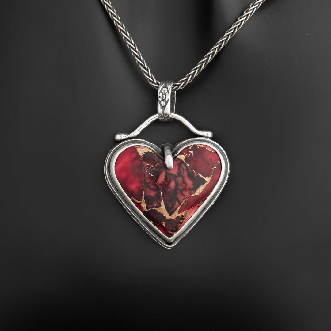 Handcrafted gothic heart necklace featuring deep red Dahlia Rose stone in sterling silver bezel with floral detailing. Handcrafted in Fort Collins, Colorado.
