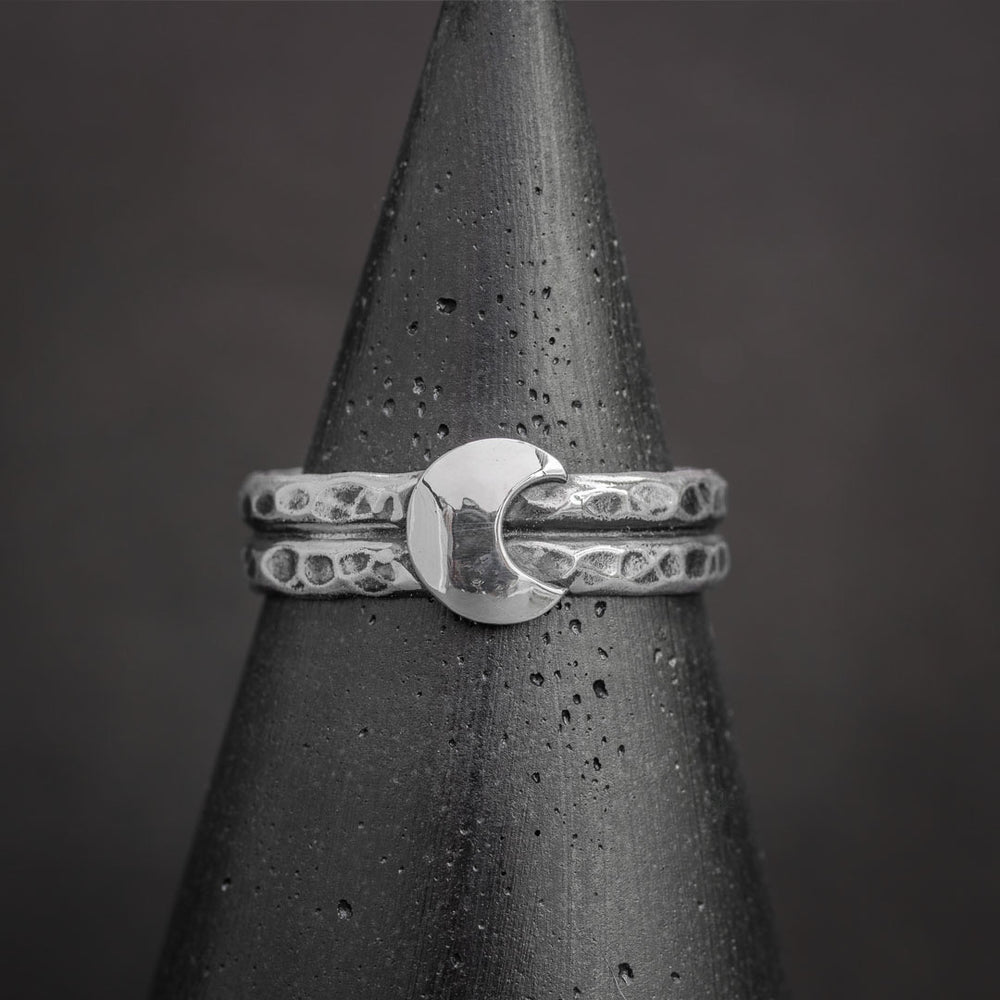 Half moon ring in sterling silver featuring textured bands and polished crescent moon design. Silver jewelry handcrafted in Fort Collins, Colorado.