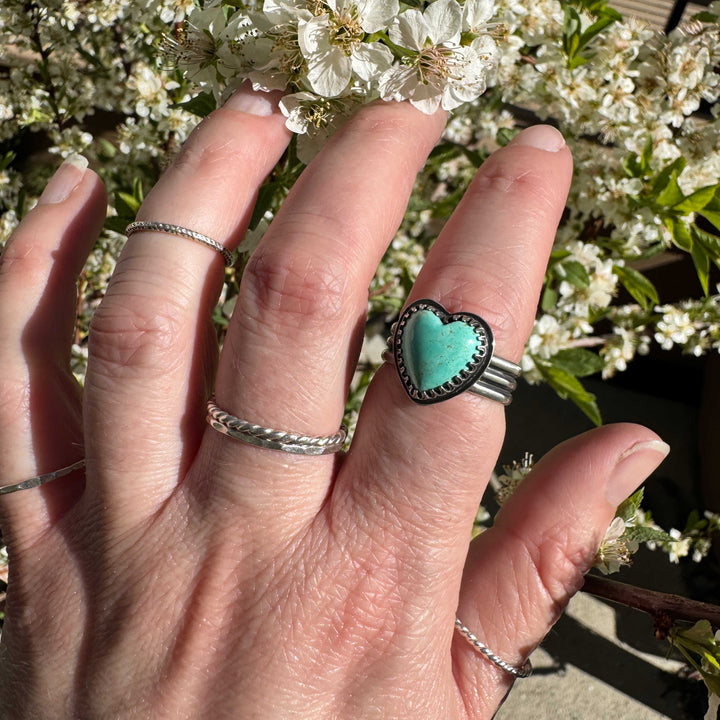 Close-up of blue heart-shaped Sonora turquoise in artisan silver ring, size 8