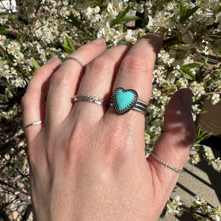 Close-up of vibrant robin's egg blue heart-shaped Sonora turquoise in artisan silver triple-band ring, size 8.5