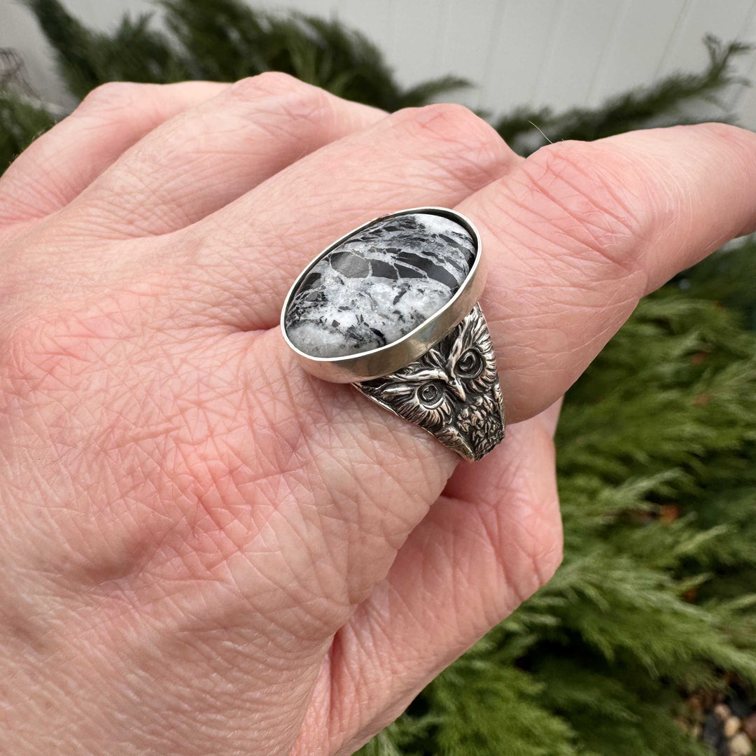 Close-up of rare White Buffalo stone showing distinctive black and white patterning in handcrafted owl ring