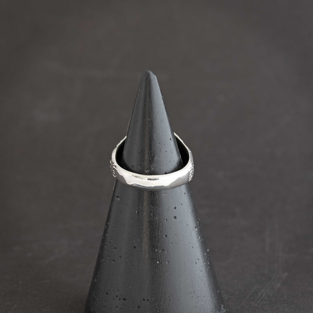 Back view of intricate owl ring on handcrafted sterling silver with White Buffalo stone