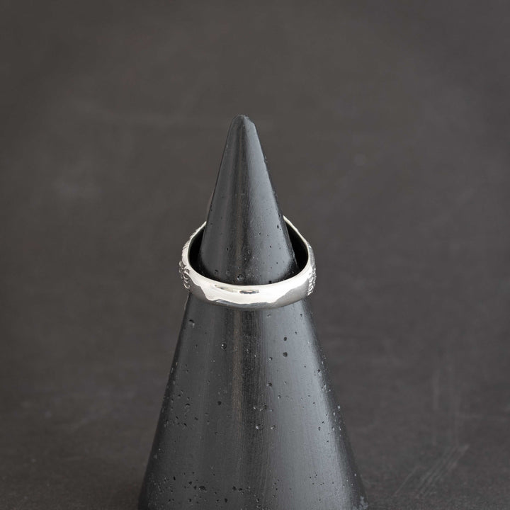 Back view of intricate owl ring on handcrafted sterling silver with White Buffalo stone