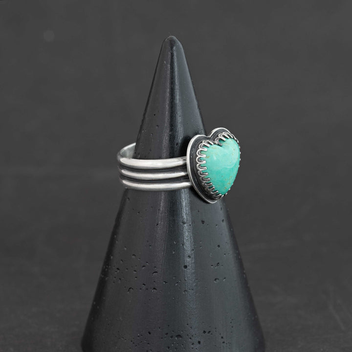 Sterling silver ring featuring vibrant blue Sonora turquoise heart, shown at angle, size 8