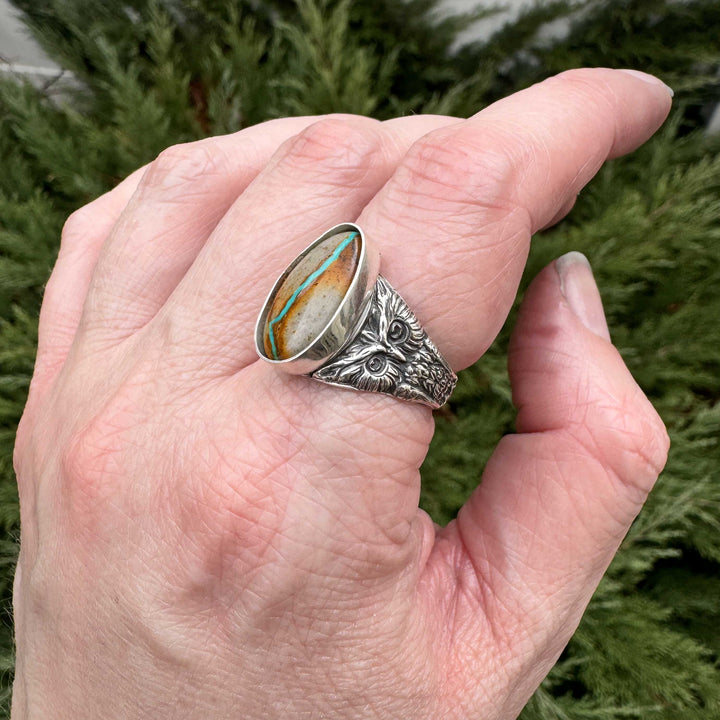 Side view of handcrafted owl ring showing detailed features and Royston Ribbon turquoise setting