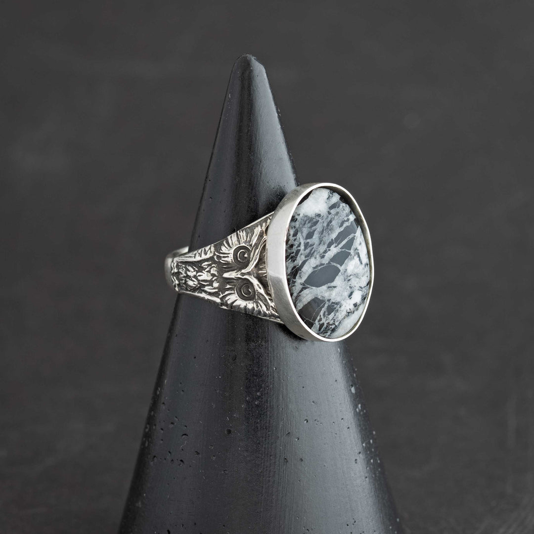 Side view of owl ring showing detailed features and White Buffalo stone setting