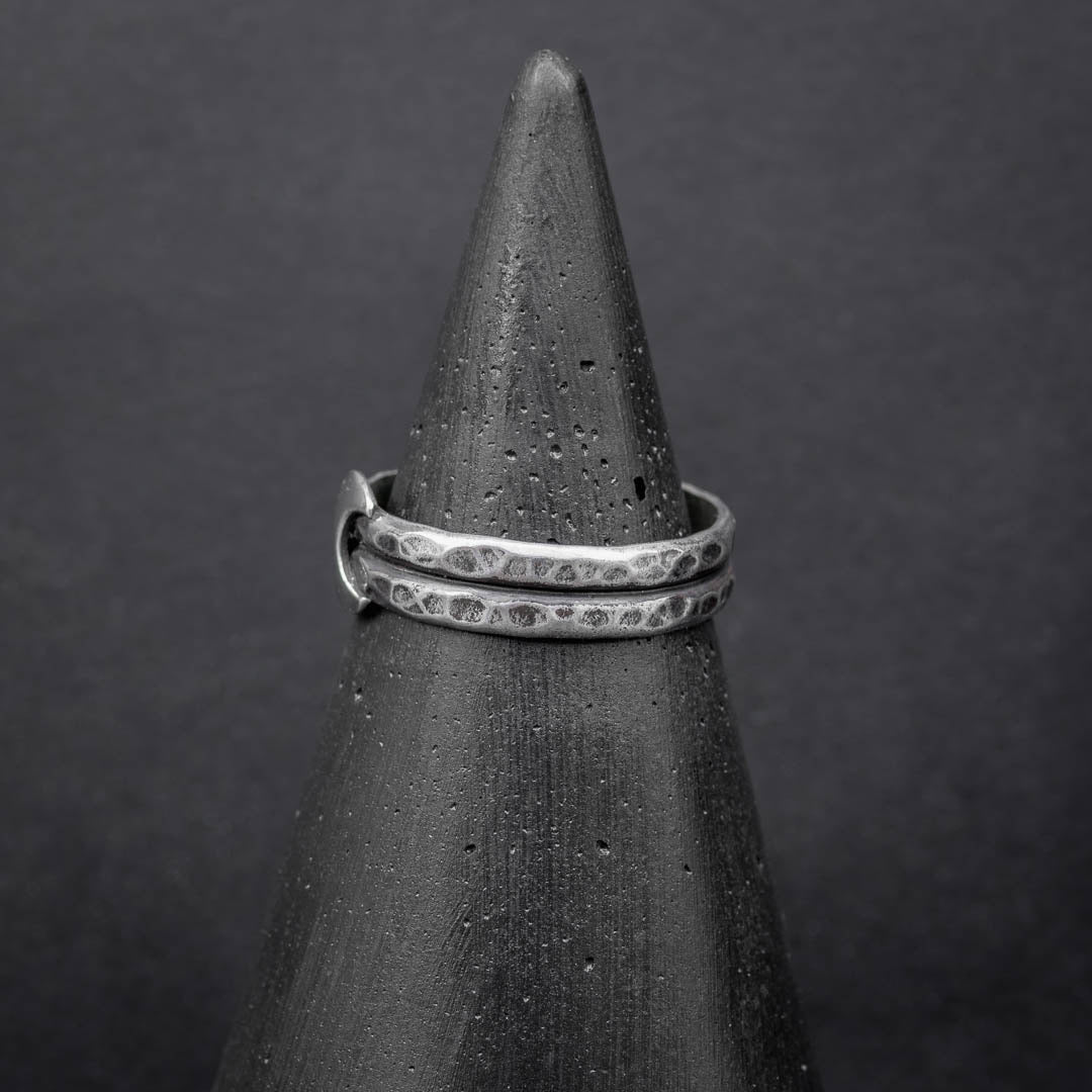 Close-up of sterling silver crescent moon ring showing detailed hammered texture and lunar design. Handmade jewelry in Fort Collins, CO.