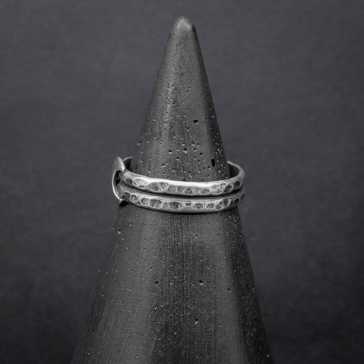 Close-up of sterling silver crescent moon ring showing detailed hammered texture and lunar design. Handmade jewelry in Fort Collins, CO.
