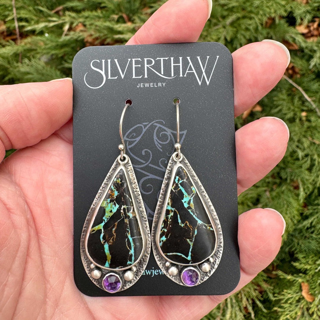Handmade Blackjack turquoise and rose cut amethyst earrings on Silverthaw Jewelry display card in natural light
