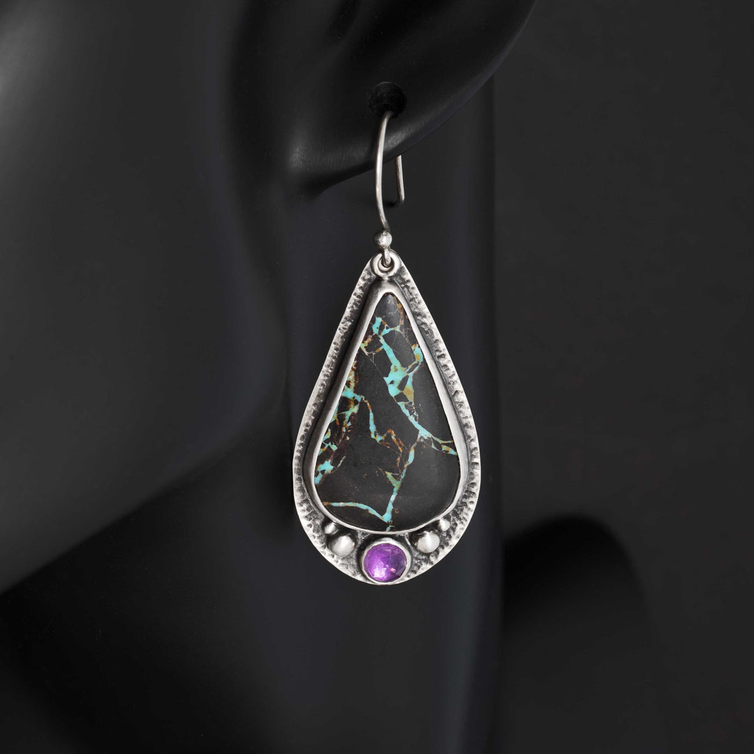 Blackjack turquoise and amethyst drop earrings worn on black mannequin showing dangle length and scale