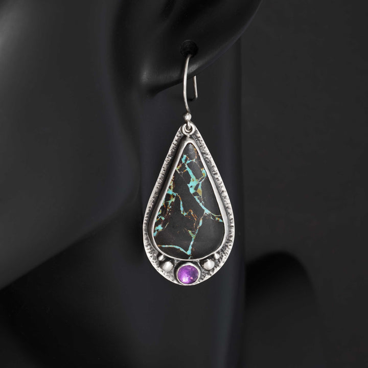 Blackjack turquoise and amethyst drop earrings worn on black mannequin showing dangle length and scale