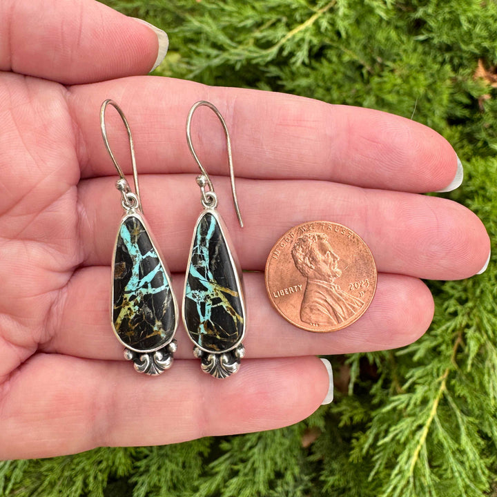 Blackjack turquoise drop earrings size reference with penny, elongated teardrop cabs in sterling silver bezel, handcrafted in Fort Collins Colorado