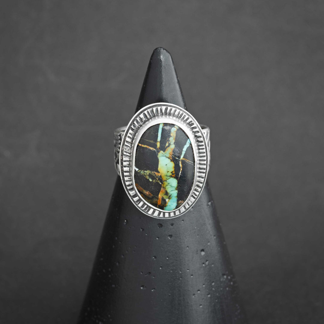 Handmade Blackjack turquoise ring in sterling silver, featuring bold black matrix and vivid turquoise webbing.