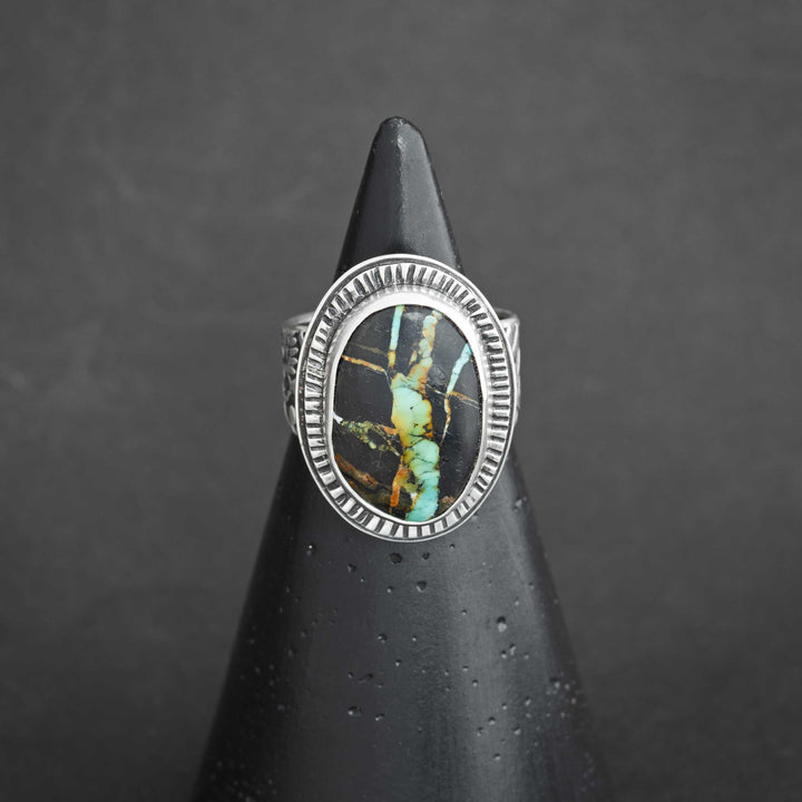 Handmade Blackjack turquoise ring in sterling silver, featuring bold black matrix and vivid turquoise webbing.