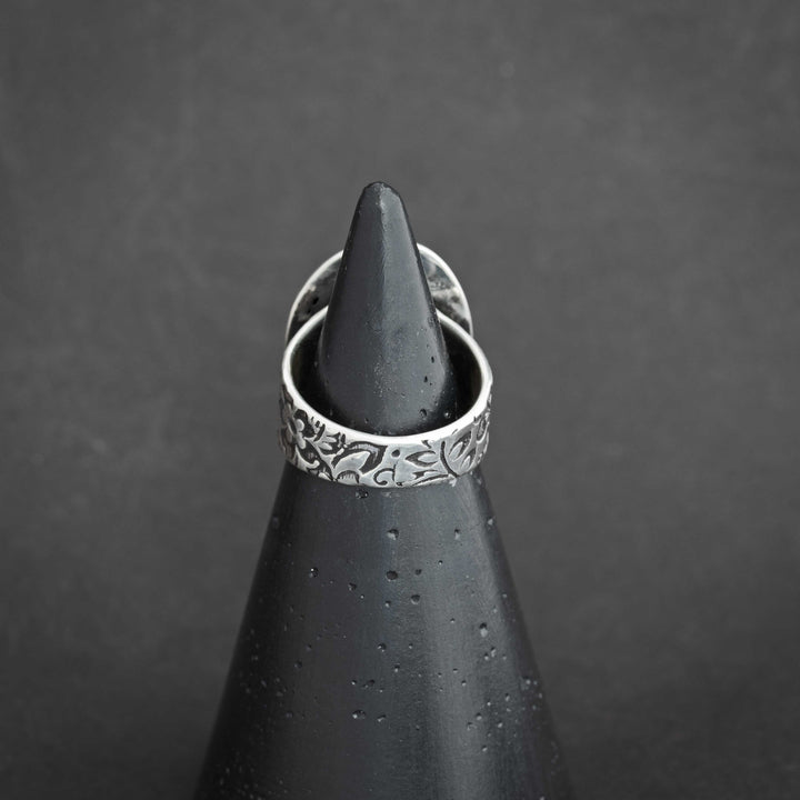 Back view of Blackjack turquoise ring with detailed floral pattern on the wide sterling silver band.