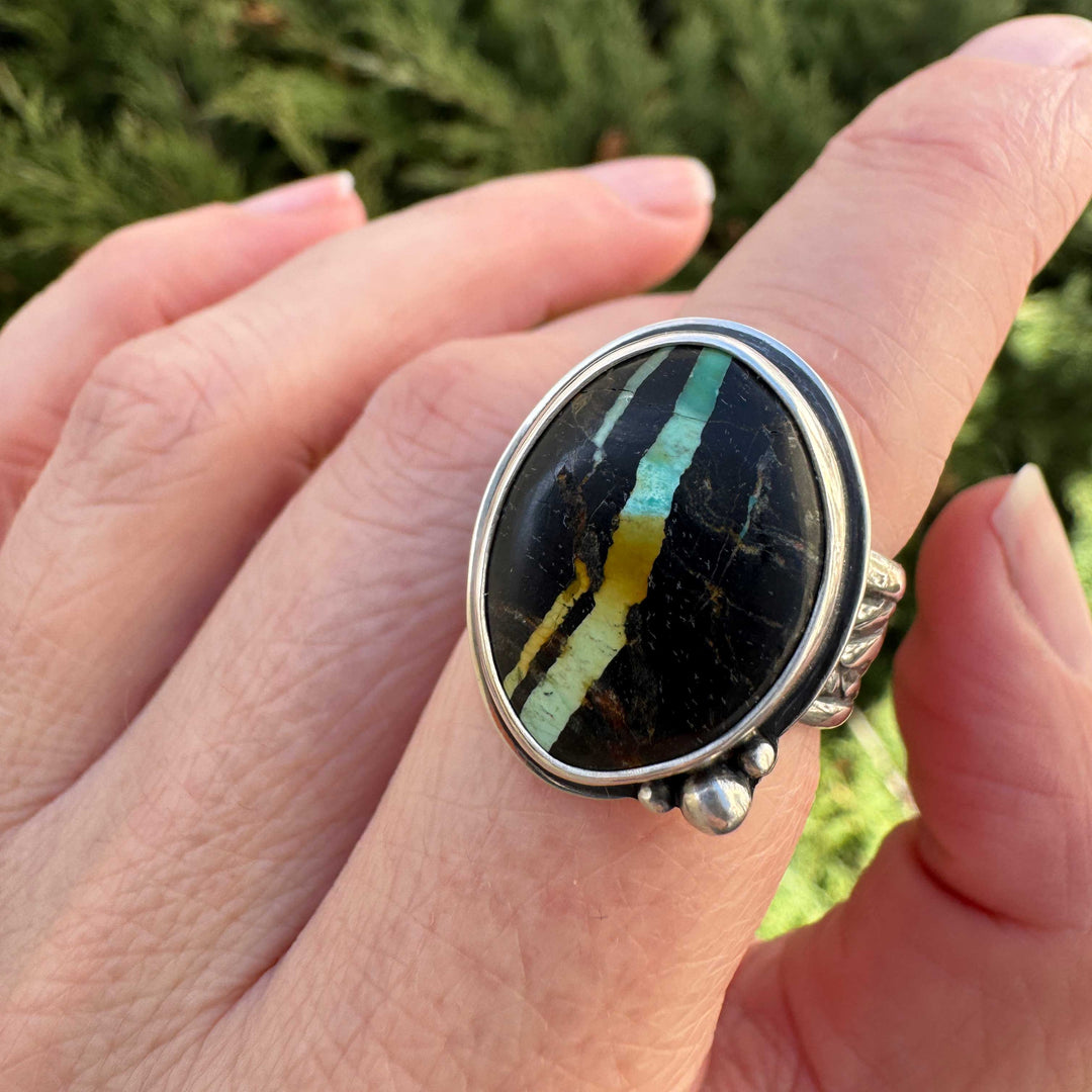 Natural Blackjack turquoise ring close-up showing vivid teal blue and gold veining in black chert matrix