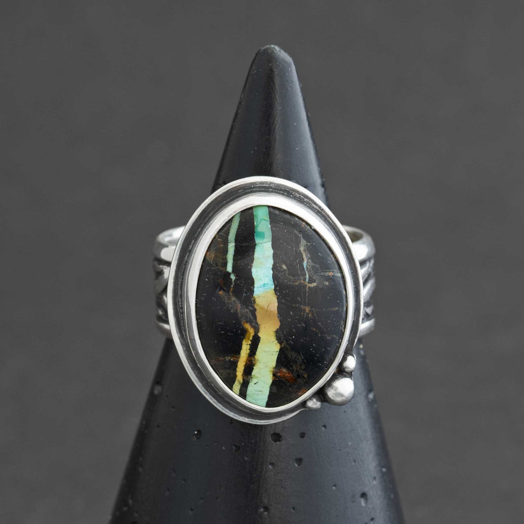 Blackjack turquoise statement ring in sterling silver on black cone display, Silverthaw Jewelry