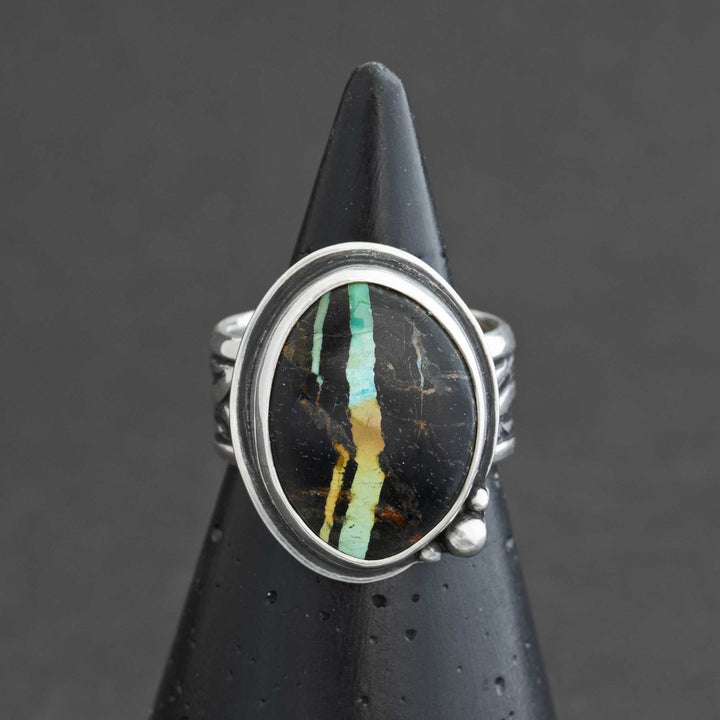 Blackjack turquoise statement ring in sterling silver on black cone display, Silverthaw Jewelry
