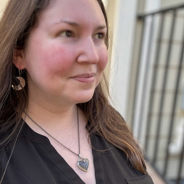 Model wearing dendritic rhyolite heart pendant necklace