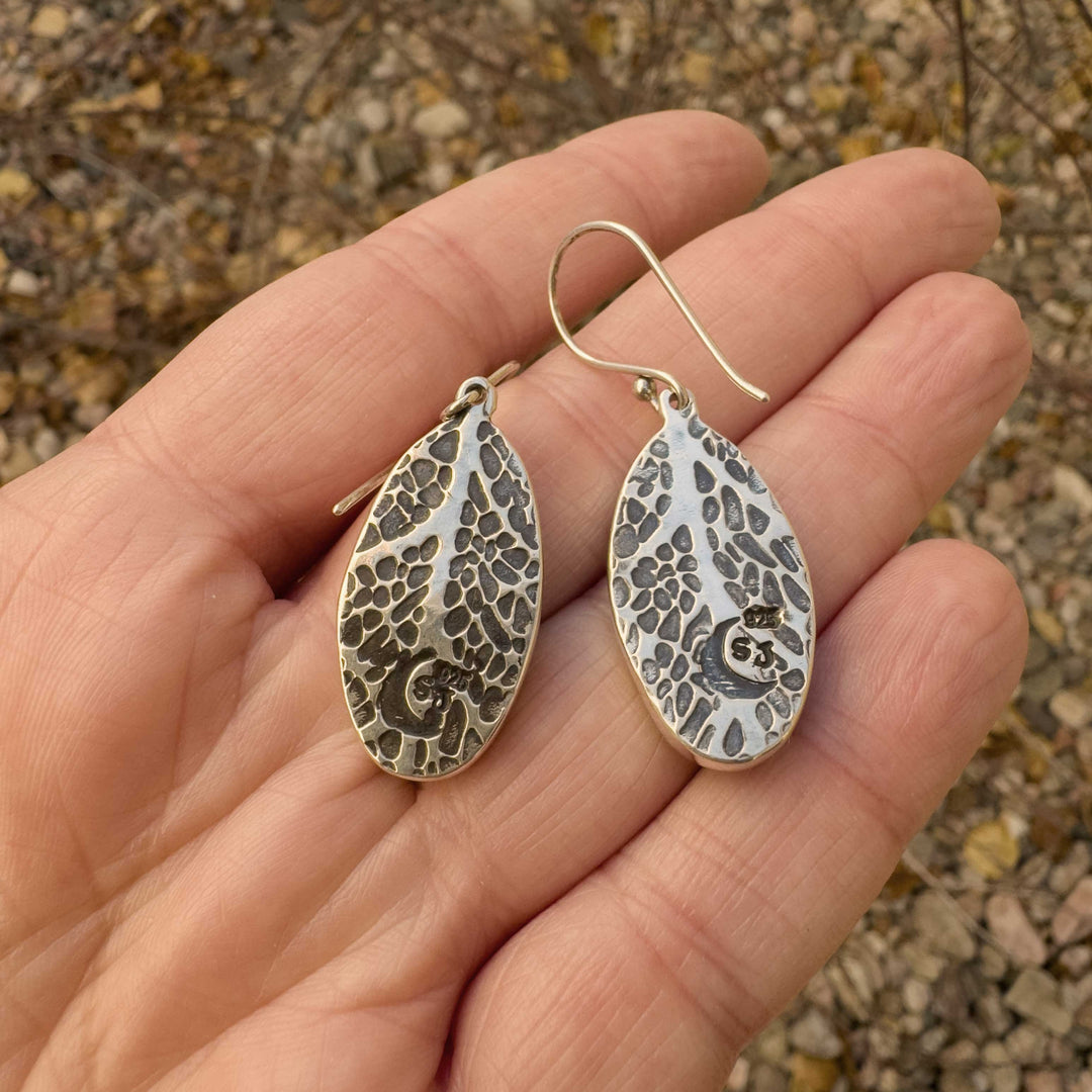 Back of Emerald Rose variscite earrings showing hand-pressed leaf texture in silver.