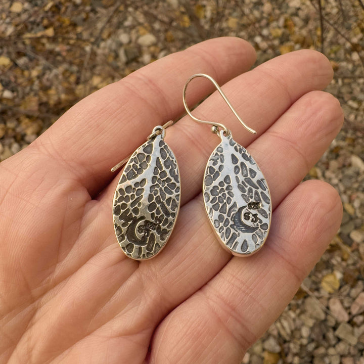 Back of Emerald Rose variscite earrings showing hand-pressed leaf texture in silver.