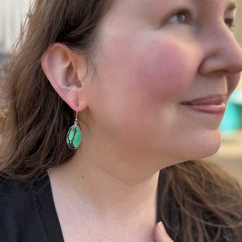 Emerald Rose variscite dangle earrings worn to show size and fit.