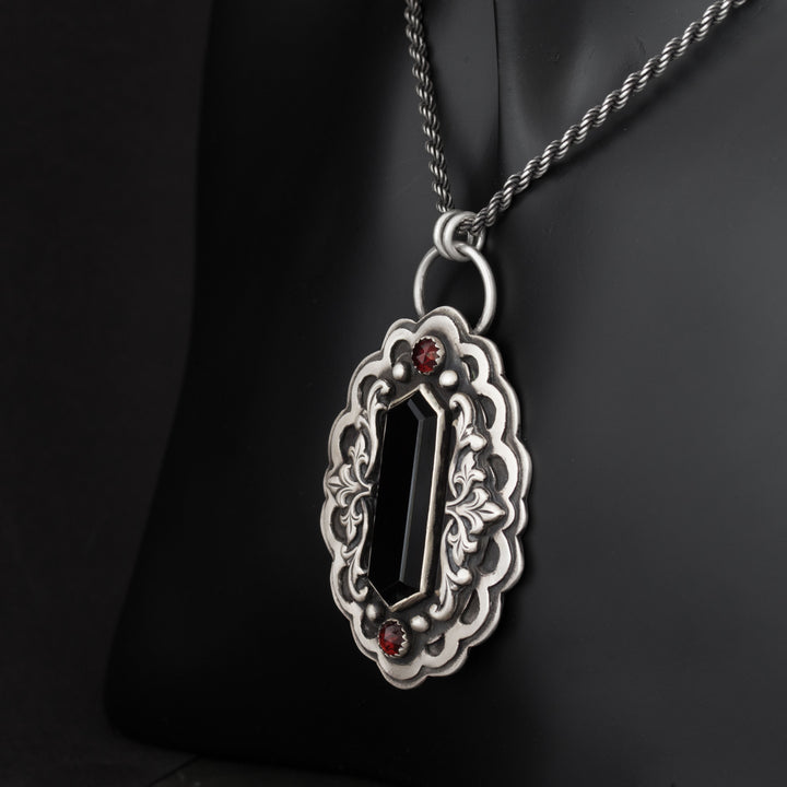 Elegant vampire-themed necklace with black onyx and silver accents.