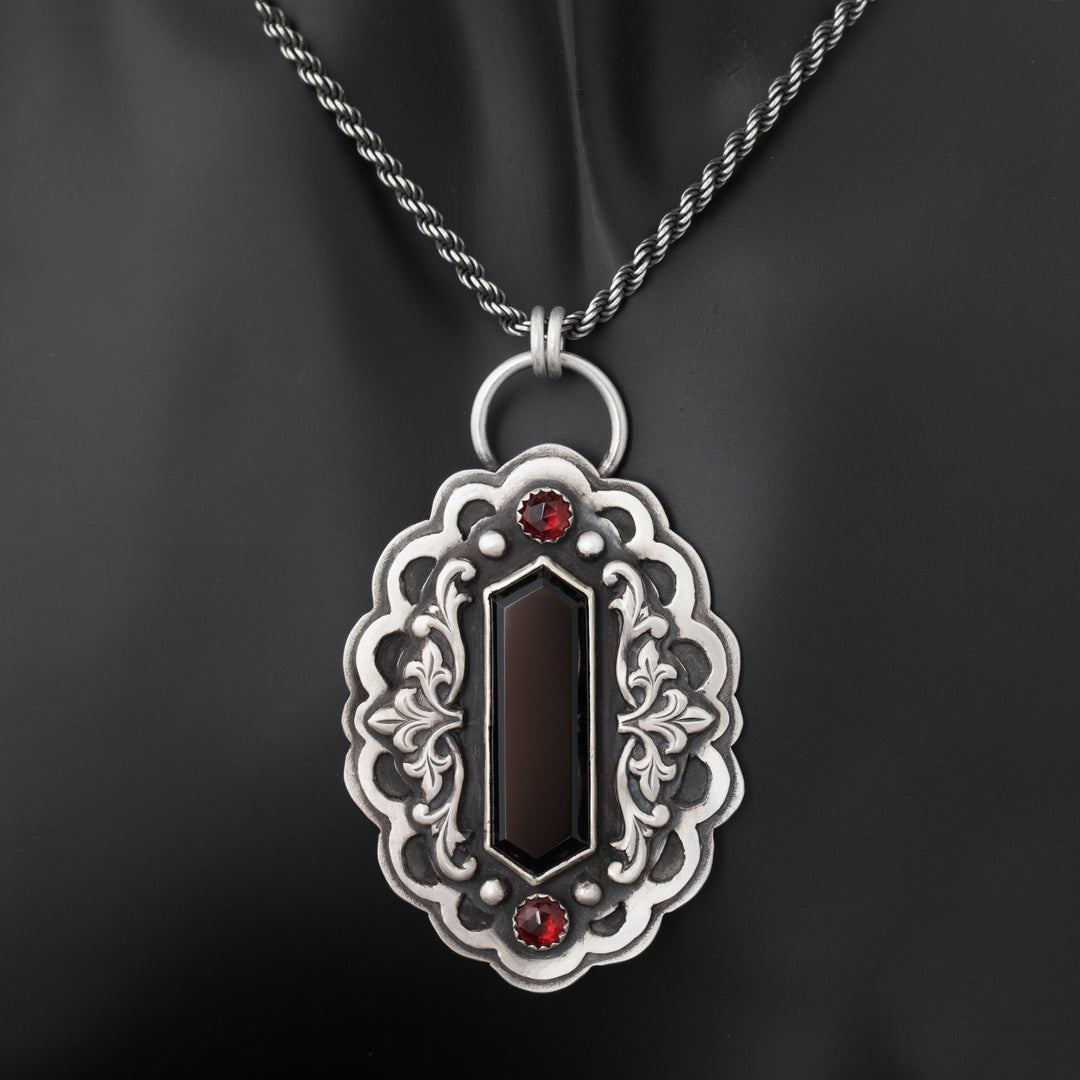 Gothic vampire statement necklace in sterling silver with black onyx and garnet, featuring ornate Victorian-inspired silver scrollwork