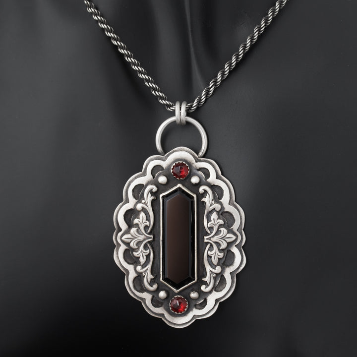 Gothic vampire statement necklace in sterling silver with black onyx and garnet, featuring ornate Victorian-inspired silver scrollwork