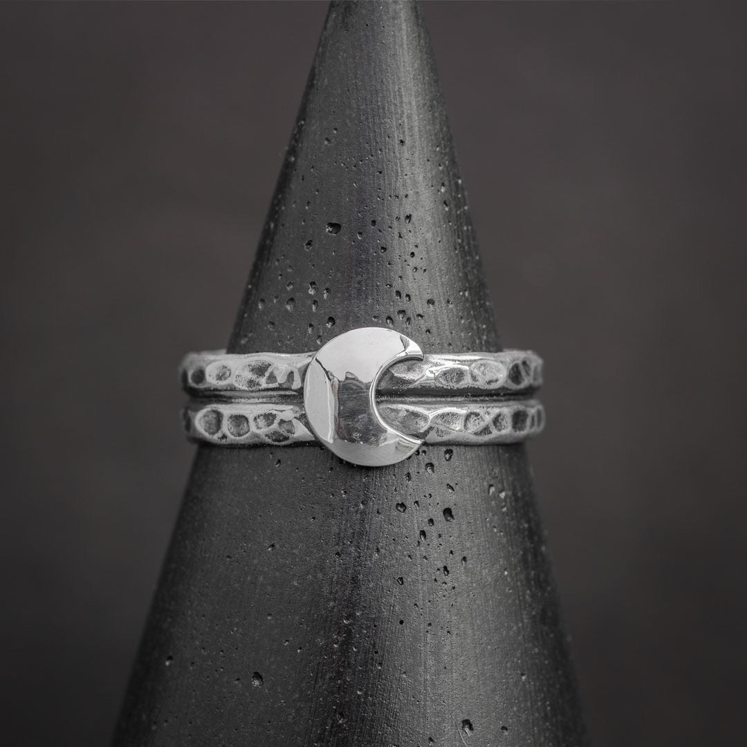 Half moon ring in sterling silver featuring textured bands and polished crescent moon design. Silver jewelry handcrafted in Fort Collins, Colorado.