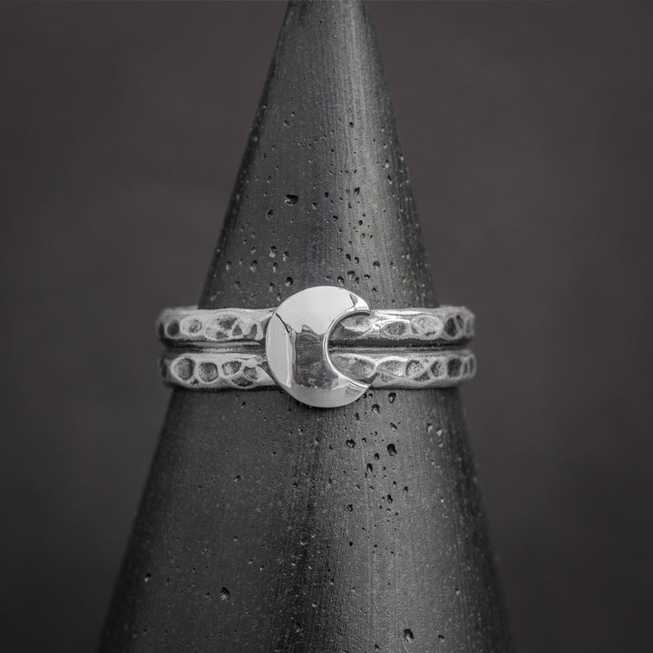 Half moon ring in sterling silver featuring textured bands and polished crescent moon design. Silver jewelry handcrafted in Fort Collins, Colorado.