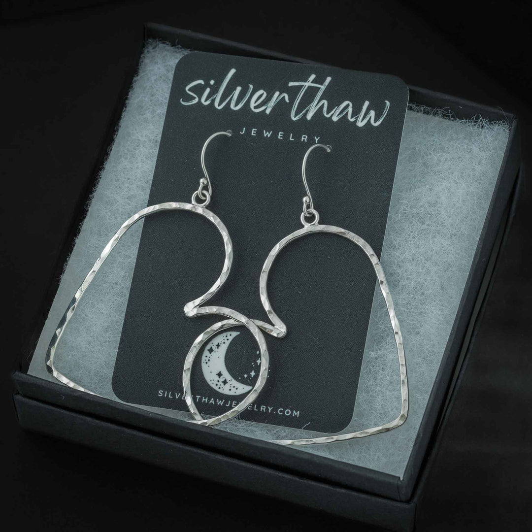 Handmade sterling silver heart hoop earrings packaged as a romantic gift