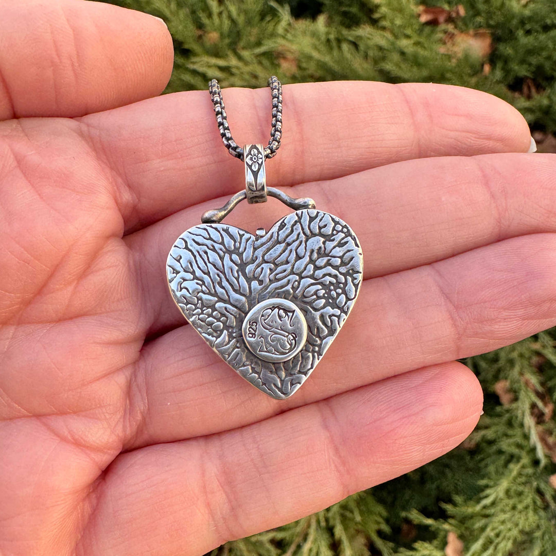 Back of sterling silver heart pendant with textured finish