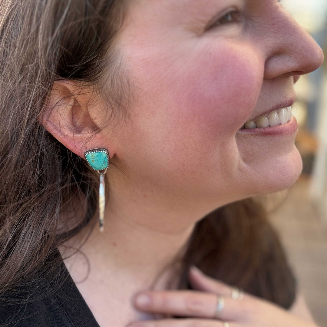 Kingman turquoise hoop earrings worn on ear with sterling silver dangles