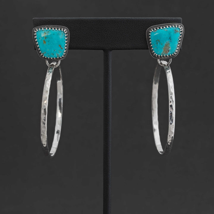 One-of-a-kind Kingman turquoise hoop earrings on black display stand