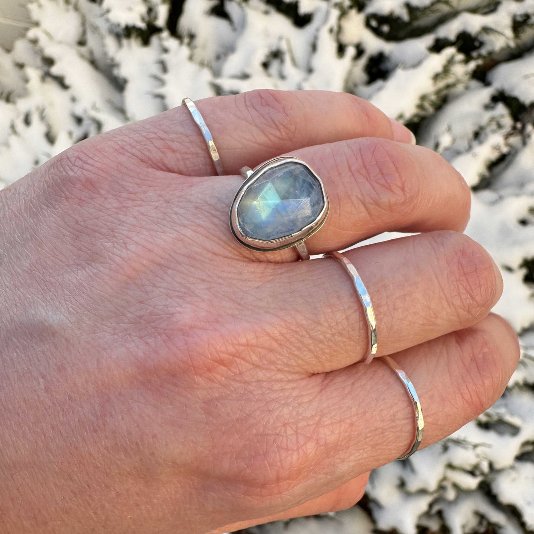 Rose cut rainbow moonstone ring size 6.5 on hand, blue to green shifting flash, snowy background