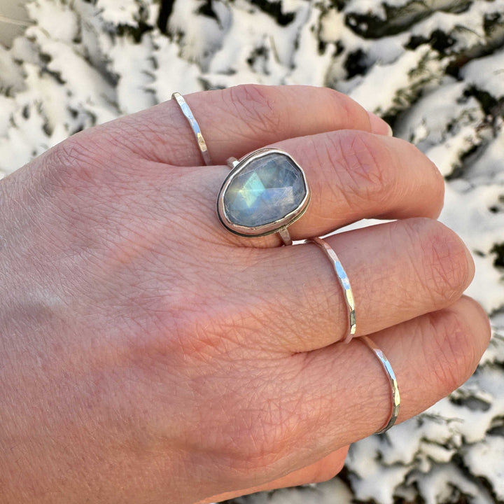 Rose cut rainbow moonstone ring size 6.5 on hand, blue to green shifting flash, snowy background