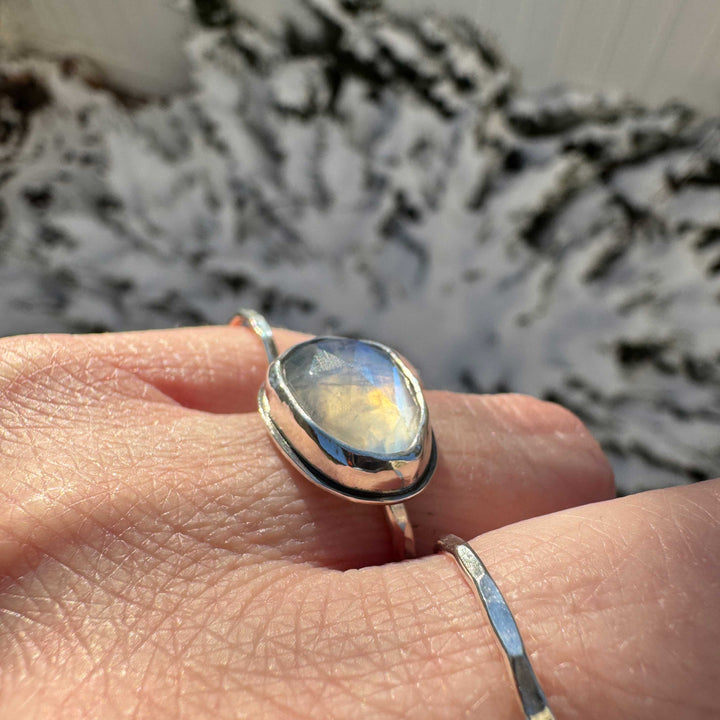 Close up of rose cut rainbow moonstone ring size 6 showing vibrant blue flash with rainbow phenomenon