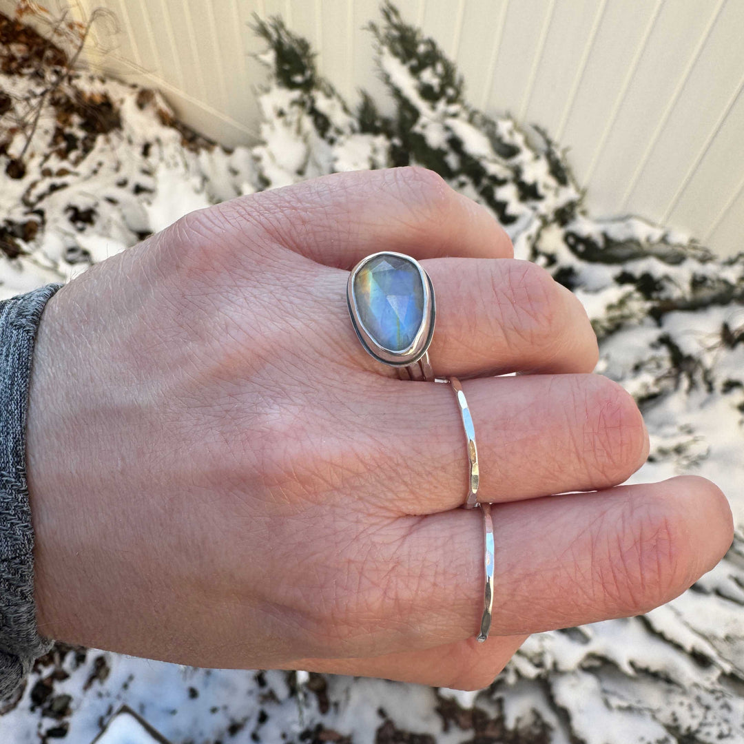 Rose cut rainbow moonstone ring size 6 in sterling silver bezel, worn outdoors in winter setting