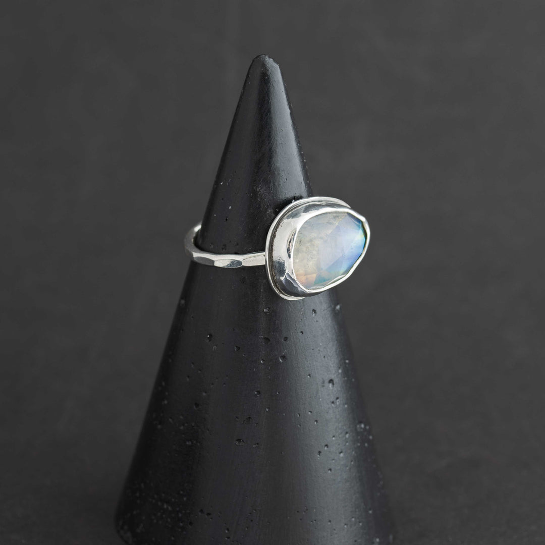 Handmade rose cut rainbow moonstone ring size 6 in sterling silver bezel, side view showing hammered band