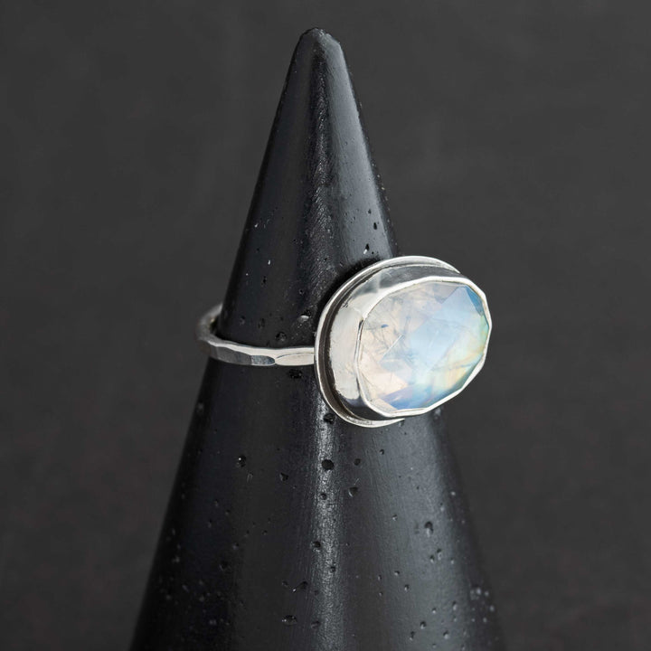 Handmade rose cut rainbow moonstone ring size 7.5 in sterling silver bezel, side view showing hammered band