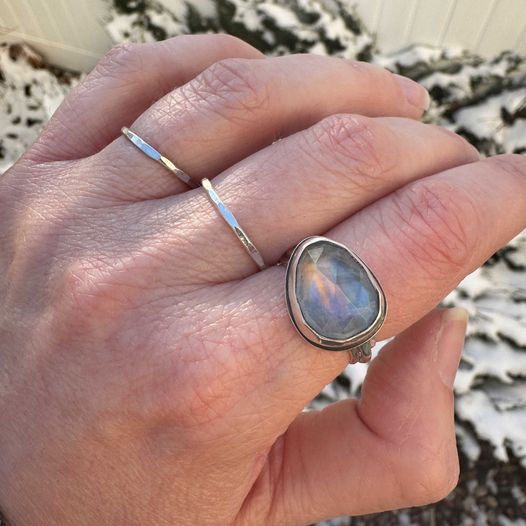 Handmade rose cut rainbow moonstone ring size 9.5 on hand outdoors, blue-purple flash with sunset orange phenomenon
