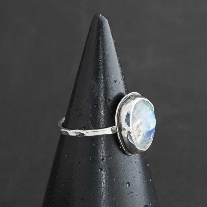 Handmade rose cut rainbow moonstone ring size 9 in sterling silver bezel, side view showing hammered band