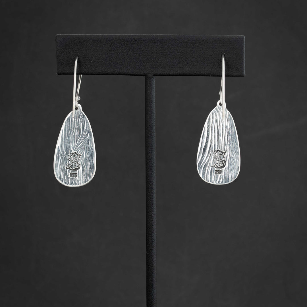 Back view of Royston Ribbon turquoise earrings with Silverthaw Jewelry maker’s mark and 925 sterling silver stamp.