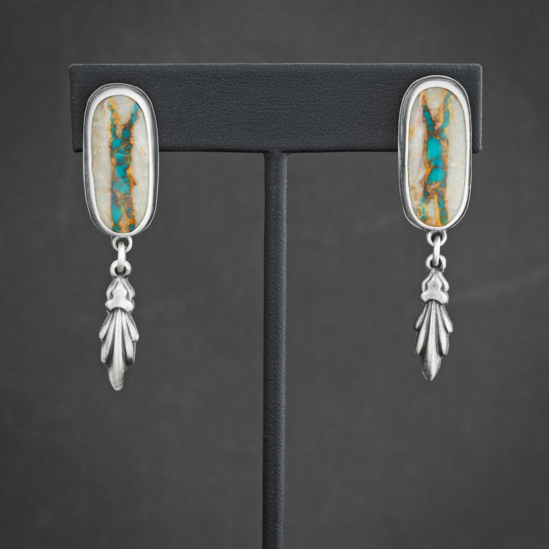 Handmade Royston Ribbon turquoise drop earrings in sterling silver with a flourish dangle detail.