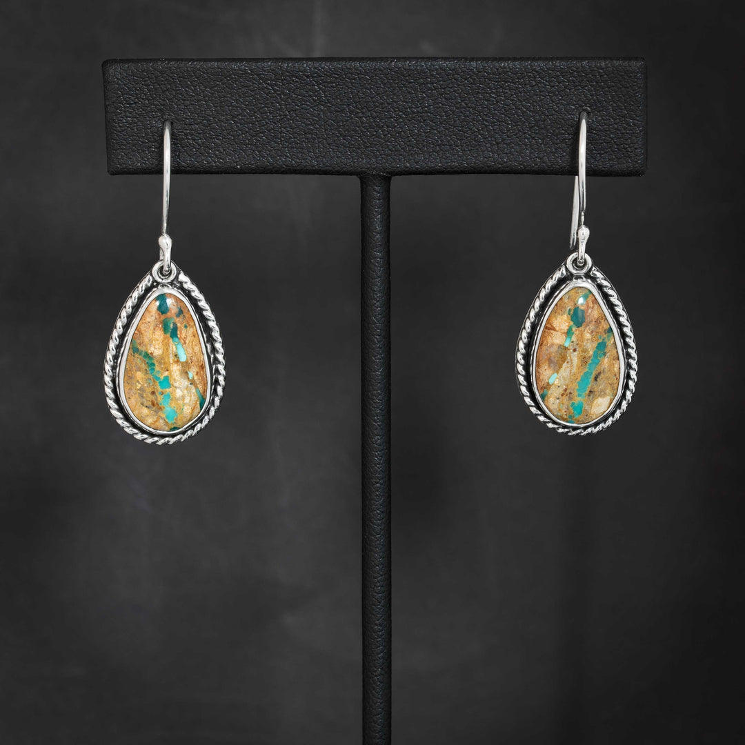 Pair of handmade Royston Ribbon turquoise earrings in sterling silver, with natural brown matrix and turquoise streaks.