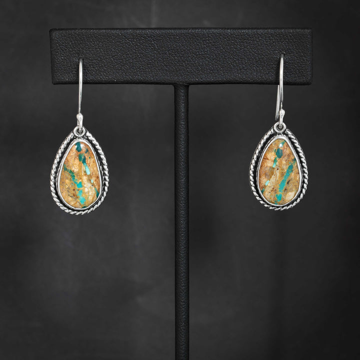 Pair of handmade Royston Ribbon turquoise earrings in sterling silver, with natural brown matrix and turquoise streaks.