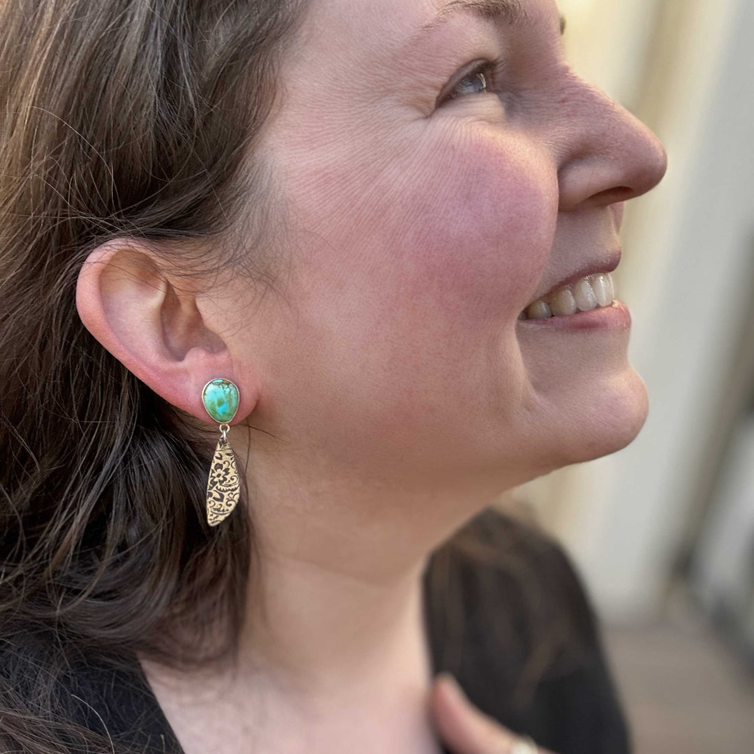 Sterling silver Sonoran Gold turquoise western floral dangle earrings worn on ear