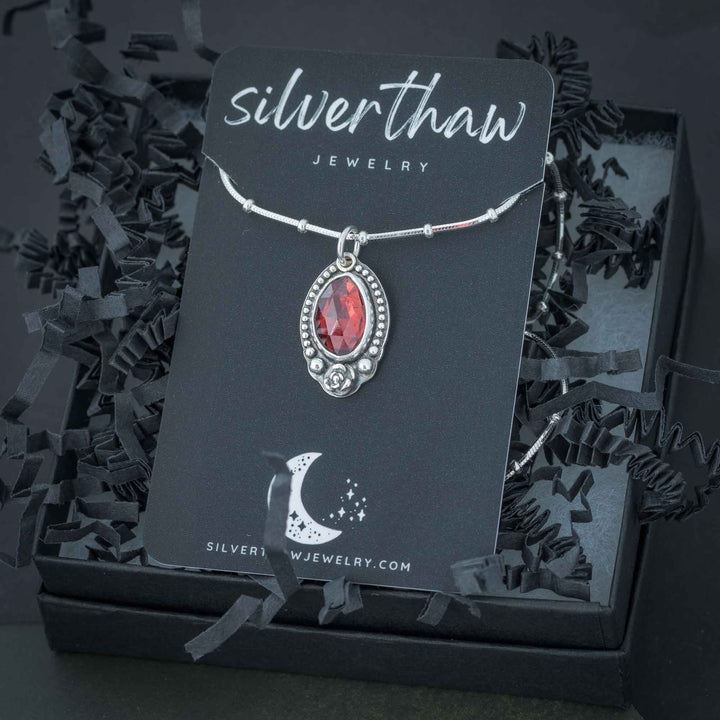 Elegant red garnet rose necklace in a gothic style.